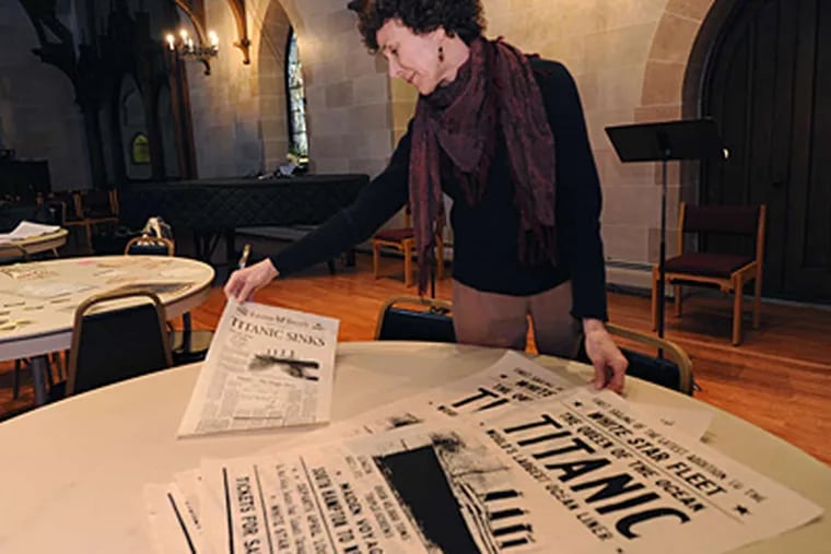 Kate Mallon-Day looks over posters. She sings in a show this weekend at St. Paul's Episcopal Church in Elkins Park memorializing the Widener family, who lost two members on the Titanic. APRIL SAUL / Staff Photographer