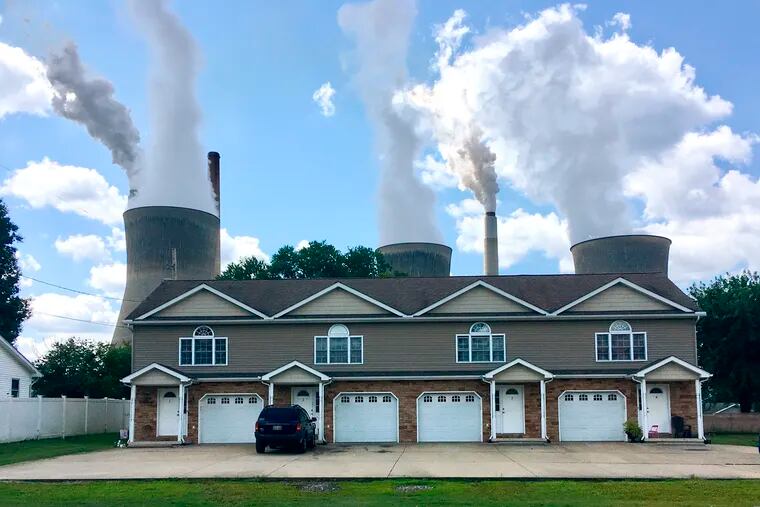 A coal-fired plant in Winfield, W. Va, is seen from an apartment complex in the town of Poca across the Kanawha River. The Trump administration is gutting an Obama-era rule that compelled coal plants to cut back emissions of mercury and other human health hazards, limiting future regulation of air pollutants by petroleum and coal plants.