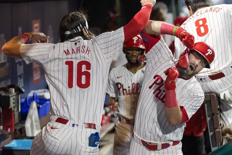 Kyle Schwarber (right) hit two home runs for the Phillies, accounting for 3 of the team's 7 runs.