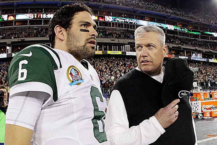 Jets head coach Rex Ryan talks with quarterback Mark Sanchez. (Wade Payne/AP)