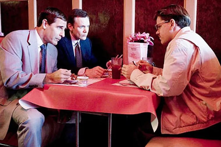 Matt Damon (right) plays the central character in “The Informant!” with Scott Bakula (left) and Joel McHale as FBI agents.