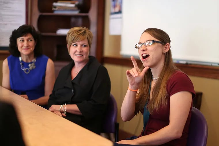 Deaf staffer Colleen Jordan signs, with Anna Marshalick, Mercy LIFE's director of education (left), and Molly Crumley, director of operations. &quot;I didn't even realize that I had a hidden talent with the residents here,&quot; Jordan explained. DAVID SWANSON / Staff Photographer