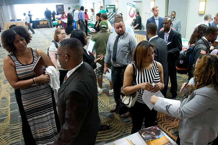 Job seekers and recruiters met at a Philadelphia job fair in June.