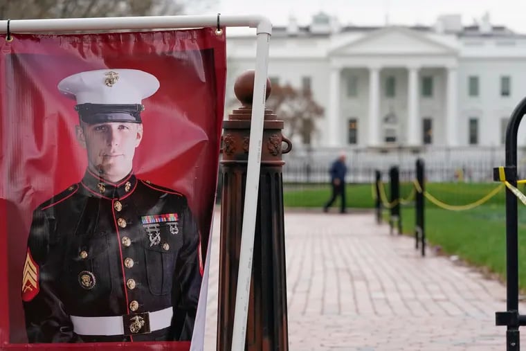 A poster photo of U.S. Marine Corps veteran and Trevor Reed standing in Lafayette Park near the White House on March 30.