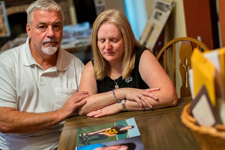 John and Kathleen Kocher look over pictures of their son, Matthew, who drowned in Lake Michigan recently in a rip tide. Internet trolls hijacked the Facebook page dedicate to Matthew's memorial posting rude comments about him and his death. (Zbigniew Bzdak/Chicago Tribune/MCT)