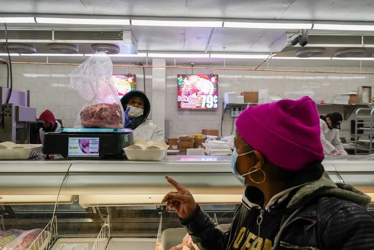 A women orders meat at Juniata Supermarket in Philadelphia, Pa., on December 1, 2021. Shoppers could increasingly see the practice of "shrinkflation" while at the grocery or shopping for other consumer, packaged goods. Instead of raising retail prices, companies will shrink the quantity or volume of a product or make packaging a little smaller. So consumers pay the same price for a little bit less.