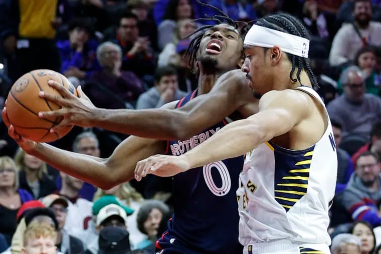 Sixers Tyrese Maxey drives on Pacers Andrew Nembhard during the 3rd quarter at the Wells Fargo Center in Philadelphia, Tuesday, November  14, 2023.