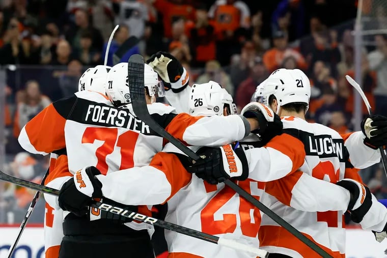 The Flyers' Tyson Foerster celebrates his second period goal against the Senators with his teammates on Saturday.