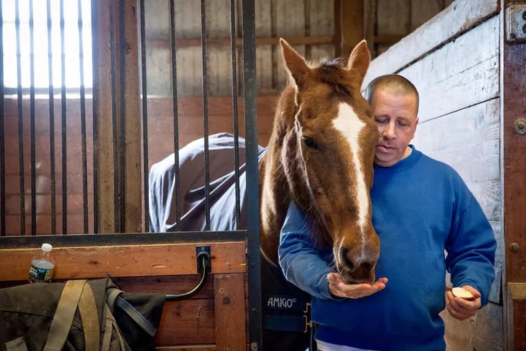 Kevin Wernik and his horse Joey are best friends, Kevin pays for all of Joey's expenses, and the duo have started a non-profit that buys teddy bears for hospital patients, they are shown here at the Seahorse Farm in Cape May, New Jersey, Monday, March 19, 2018. JESSICA GRIFFIN / Staff Photographer.