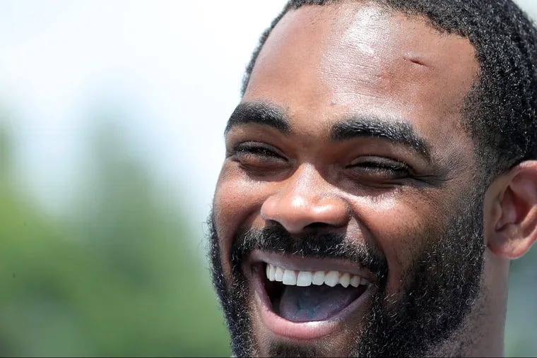 Eagles' Brandon Graham laughs as reporter asks a question after the first session of the Philadelphia Eagles training camp at the Novacare Complex on July 26, 2018 in Philadelphia, PA. DAVID MAIALETTI / Staff Photographer