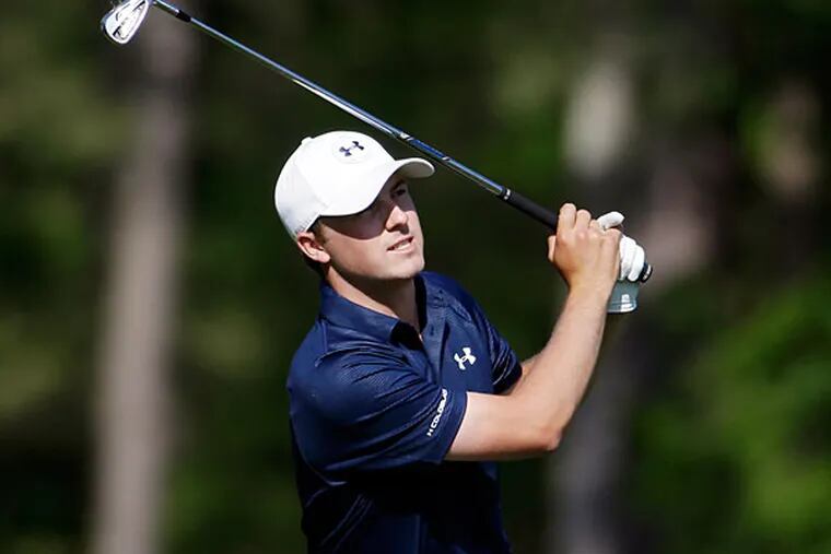 Jordan Spieth watches his tee shot on the 12th hole during the third round of the Masters golf tournament Saturday, April 12, 2014, in Augusta, Ga. (Darron Cummings/AP)