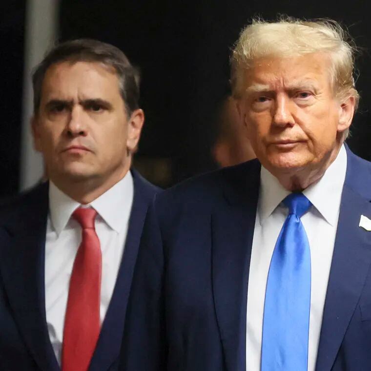Republican presidential candidate and former U.S. President Donald Trump walks next to his attorney Todd Blanche, at Manhattan state court in New York on Monday.