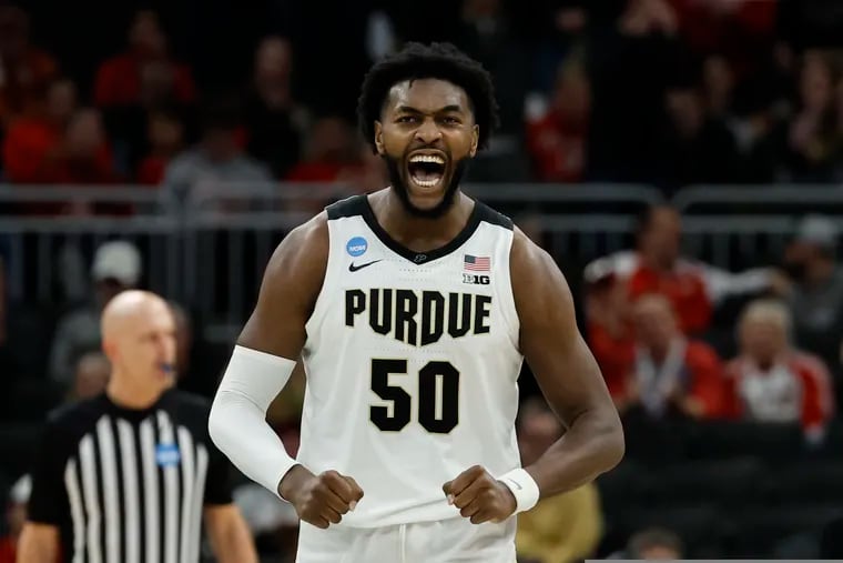 Purdue's Trevion Williams celebrates during the second half of a second-round NCAA college basketball tournament game against Texas.