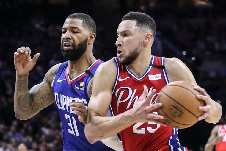 Sixers' Ben Simmons drives on Clippers' Marcus Morris Sr. during the 2nd quarter at the Wells Fargo Center on Tuesday.