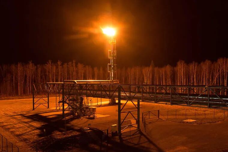 A gas flare illuminates the forest at Eesti Energia AS's Enefit 280 oil shale processing plant and energy production facility in Narva, Estonia. Eesti Energia is one of the world's largest oil shale energy companies with an annual production of around 1.3 million barrels of shale oil. Shale oil from places such as Pennsylvania is revolutionizing the world's energy industries. PETER KOLLANYI / Bloomberg