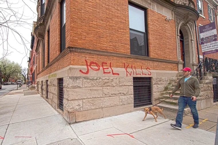 Graffiti saying "Joel Kills" is shown outside the mansion of Joel Freedman, the owner of Hanhemann University Hospital, which put a $1 million price tag on renting the former hospital for overflow space.