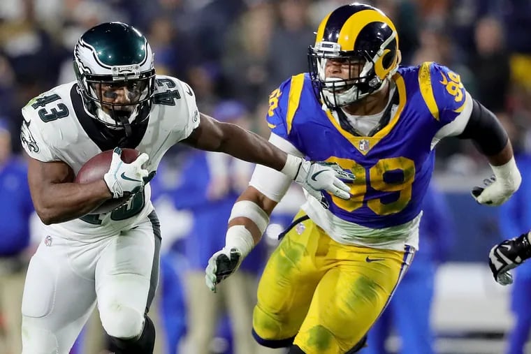 Rams defensive tackle Aaron Donald chases down the Eagles' Darren Sproles in 2018.