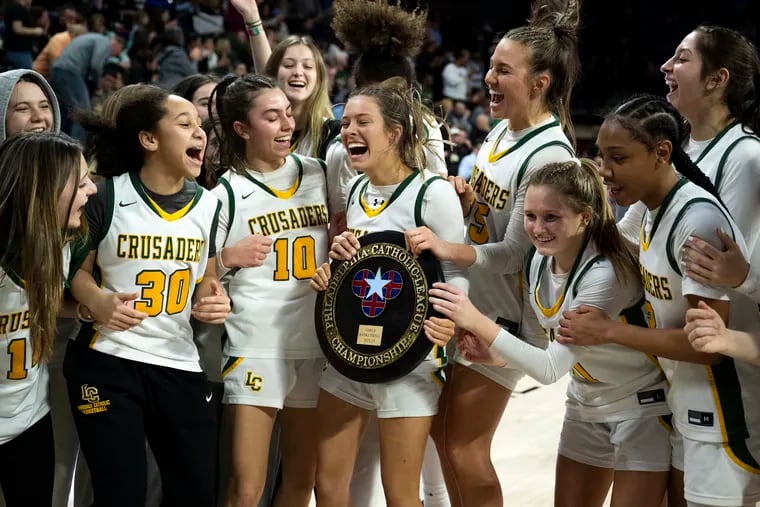 Lansdale Catholic’s Alana Ciccocelli (center) reacts with her team after a 50-47 win over Archbishop Wood Monday, Feb. 27, 2023 in Philadelphia, Pa.