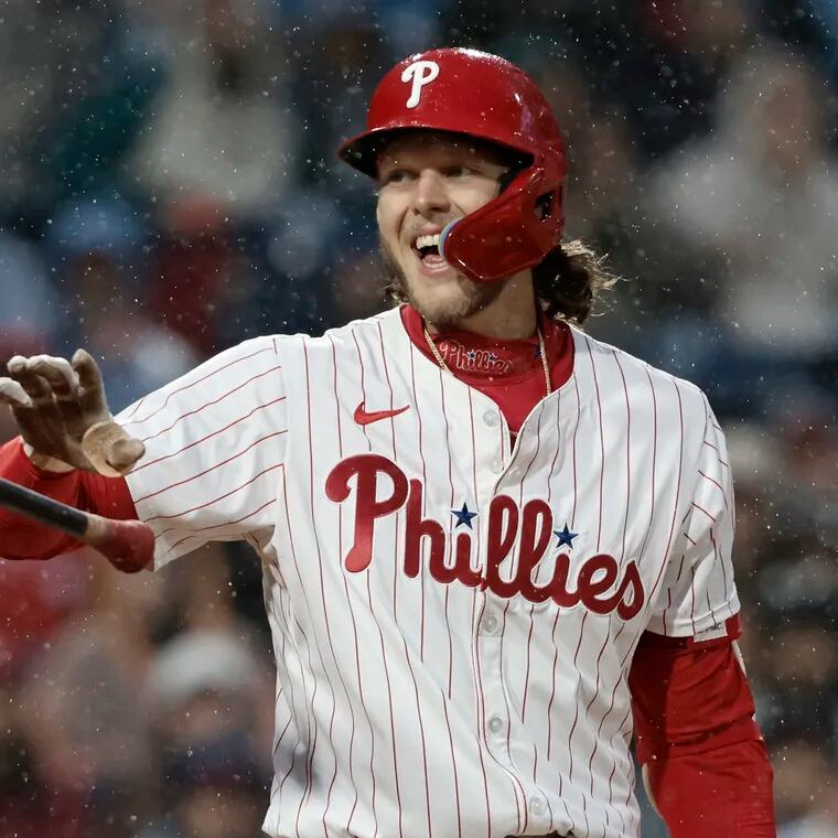 Phillies' Alec Bohm laughs as he tosses the bat after getting hit by a pitch in the first inning against the Giants on May 4.