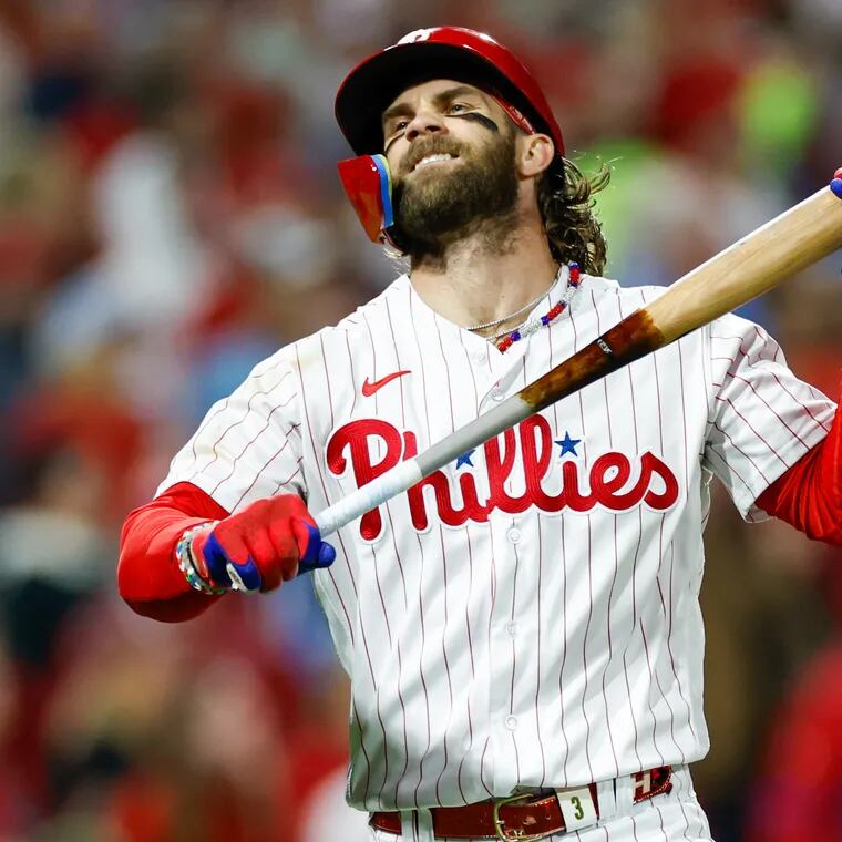 Philadelphia Phillies Bryce Harper reacts after hitting a long fly ball in the fifth inning.