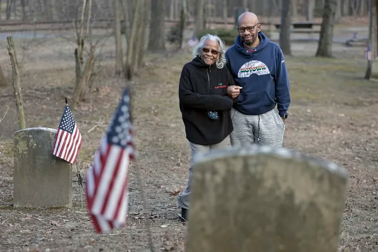 Mary Weston (left) and her son Guy Weston in a historic Timbuctoo graveyard in Westampton Township, Burlington County in early February.