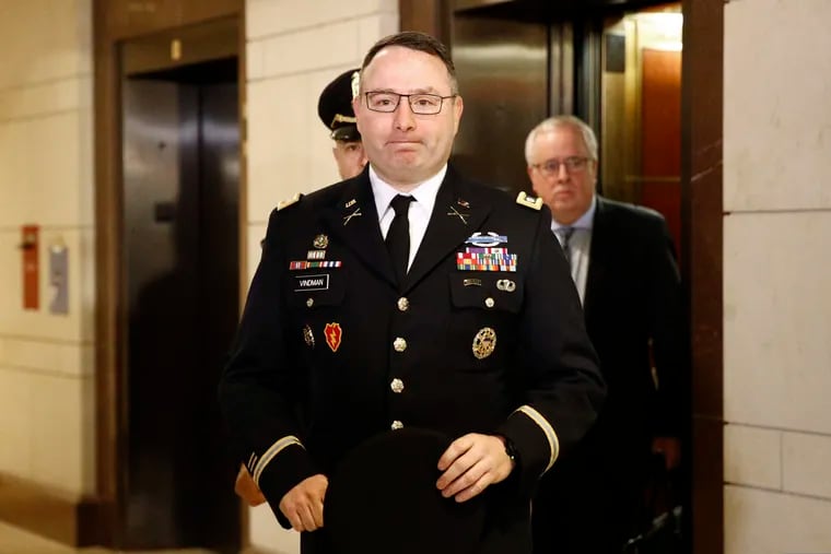In this Oct. 29, 2019, file photo, Army Lt. Col. Alexander Vindman, a military officer at the National Security Council, center, arrives on Capitol Hill in Washington.