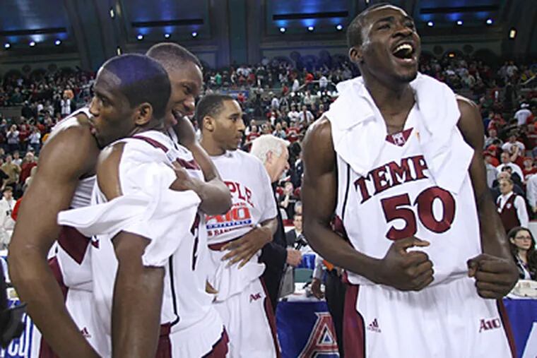Temple's Lavoy Allen, Ryan Brooks and Michael Eric celebrate their Atlantic-10 championship. (Yong Kim / Staff Photographer)