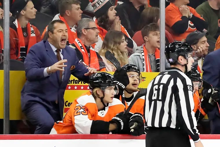 Flyers coach Alain Vigneault yells from the bench in the second period of the shootout loss to the Capitals.