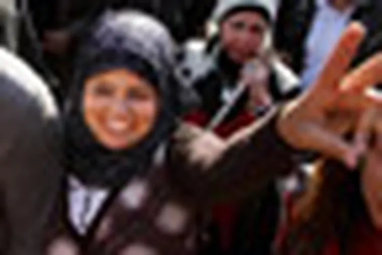 Samira Ibrahim, 25, flashes the victory sign during a rally supporting women's rights in Cairo, Egypt, Tuesday, Dec. 27, 2011. An Egyptian court has ordered the country's military rulers to stop the use of "virginity tests" on female detainees, a practice that has caused an uproar among activists and rights. Ibrahim filed a lawsuit after being subjected to a forced 'test." (AP Photo/Ahmed Ali)