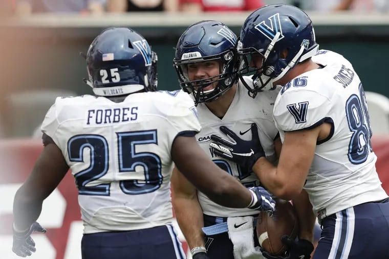 Villanova tight end Ryan Bell (center) celebrates his first-quarter touchdown with teammates running back Aaron Forbes (left) and tight end Todd Summers against Temple on Saturday, September 1, 2018. YONG KIM / Staff Photographer