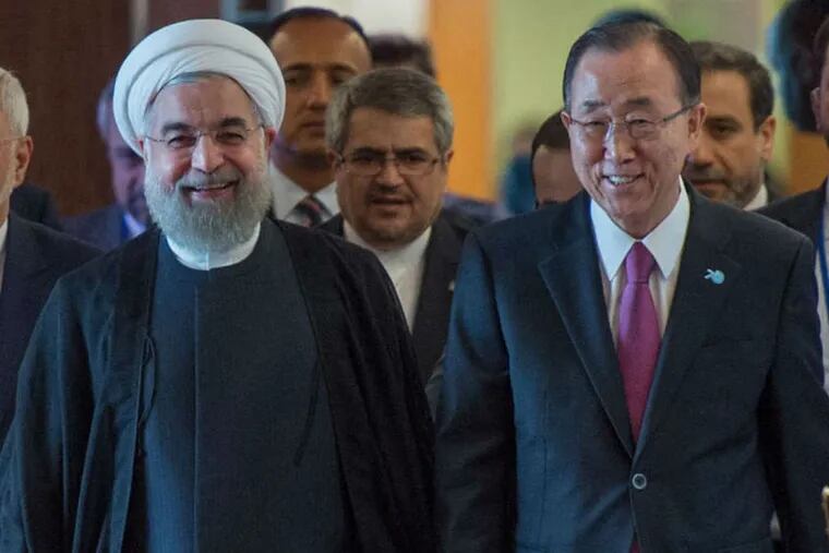 Iran's President Hassan Rouhani (left) with U.N. Secretary-General Ban Ki-moon Saturday at the United Nations. (AP Photo)