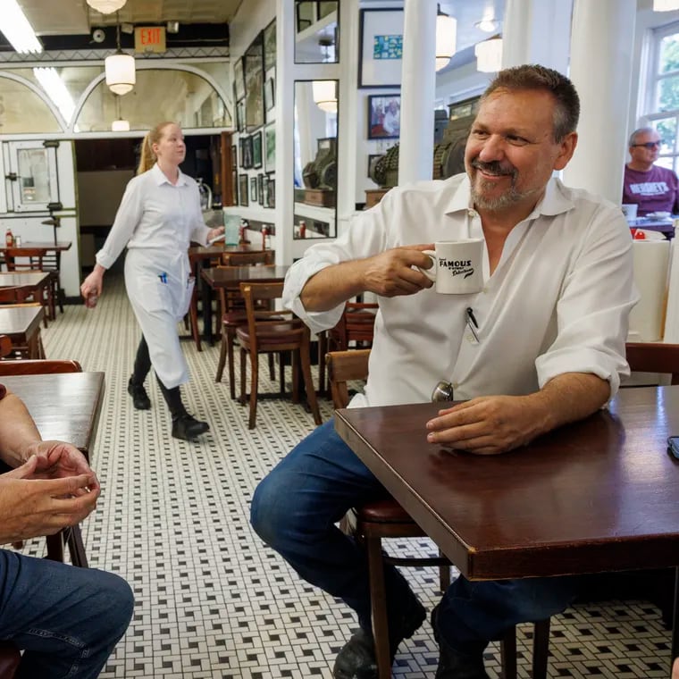 Famous 4th St. Delicatessen owner Al Gamble (right) sits with former owner David Auspitz. The deli was shut down by Philadelphia Health Department and has since reopened.