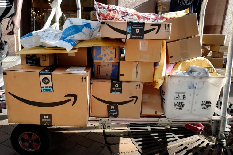 Amazon boxes are loaded on a cart for delivery in New York.