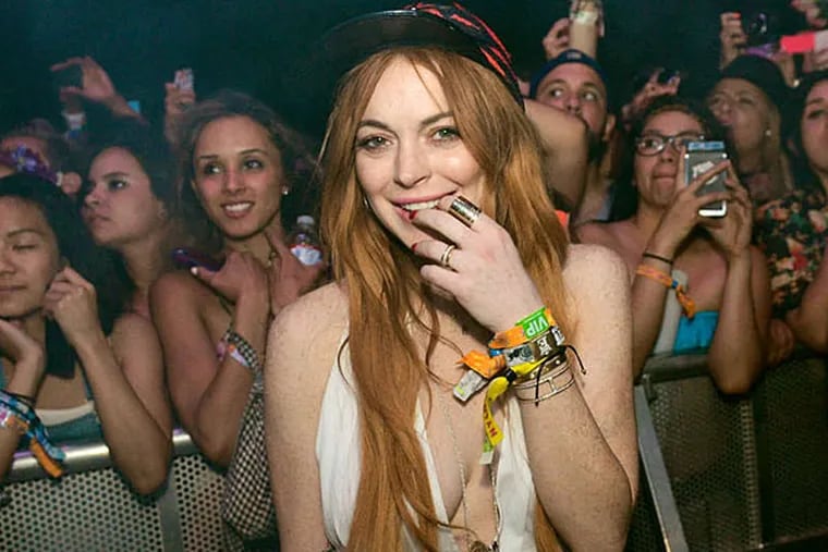 Lindsay Lohan, in the spotlight (why?) at Coachella fest Sunday. (Associated Press)