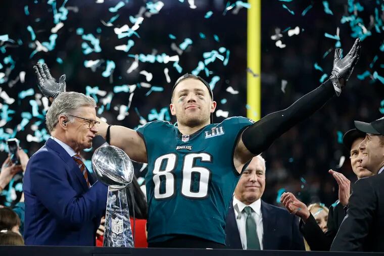 Eagles tight end Zach Ertz celebrates on the victory stand as his team, the Eagles defeated the Patriots because of Ertz’s touchdown catch in the last few minutes of the fourth quarter.  The New England Patriots versus the Philadelphia  Eagles in Super Bowl LII in Minneapolis MN on Febuary, 2018.