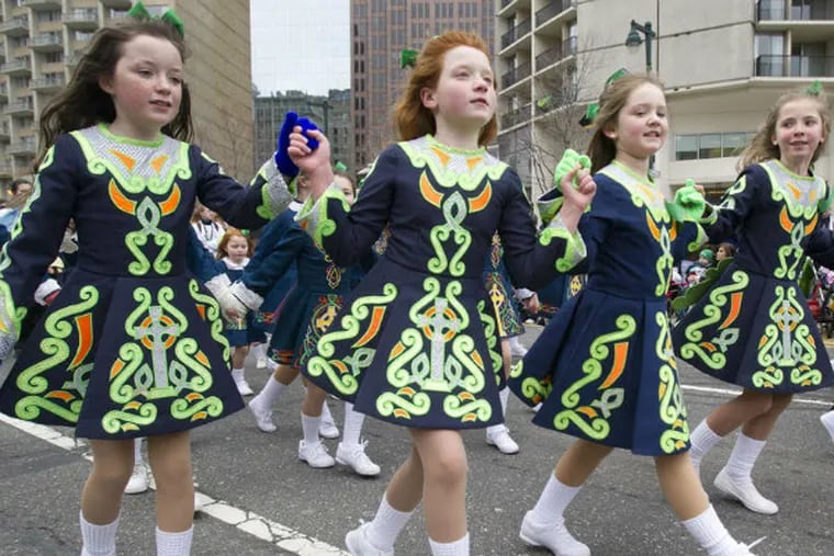 Members of the Cara School of Irish Dance in Drexel Hill dance along the Benjamin Franklin Parkway on Sunday.
