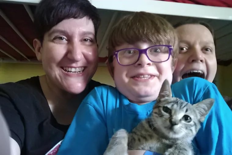 In August 2018, kitty Snax was welcomed home. From left to right: Teri, Asher holding Snax, and Rachel.