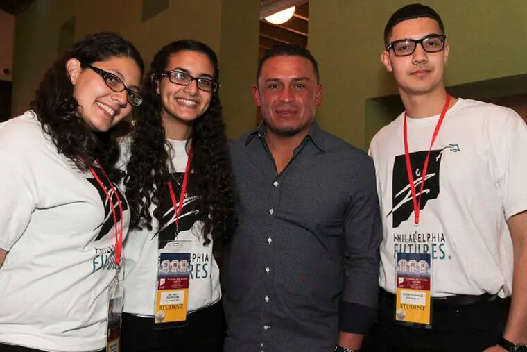 Former Phillies catcher Carlos Ruiz (second from right) with students in the program. Philadelphia Futures