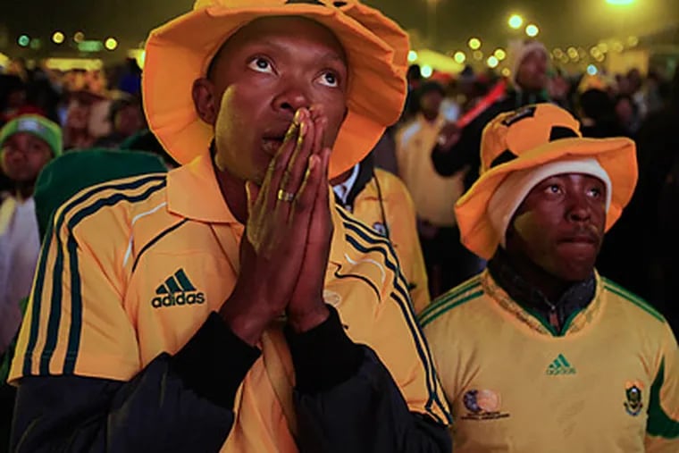 South Africa is in danger of becoming the first ever host nation to not make the World Cup's second round. (Ricardo Mazalan/AP)