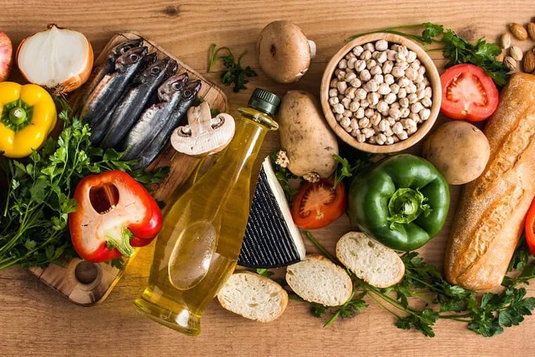 The Mediterranean diet is high in vegetables, fruit, whole grains, nuts, legumes, fish, and olive oil. It also emphasizes lessening the consumption of alcohol.