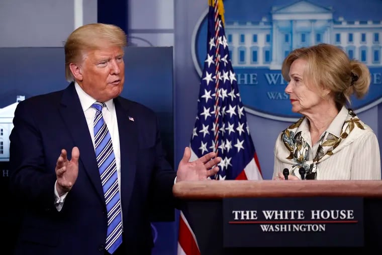 President Donald Trump asks a question to Dr. Deborah Birx, White House coronavirus response coordinator, during a White House briefing on Monday.
