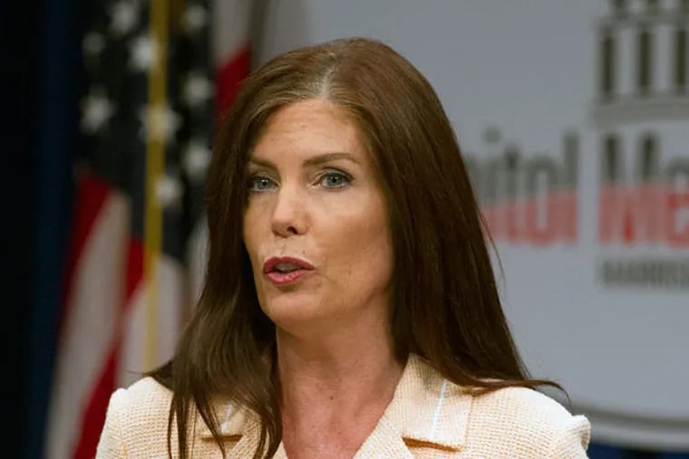 Kathleen Kane, the state’s embattled attorney general, read a 14-minute statement to the assembled media that proclaimed her innocence, then took no questions. (ED HILLE/STAFF PHOTOGRAPHER)