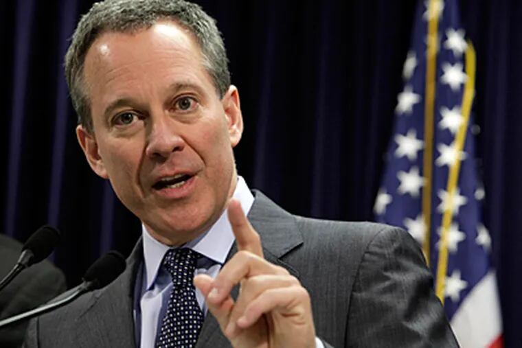 New York Attorney General Eric T. Schneiderman answers a question at a March news conference. (Associated Press)