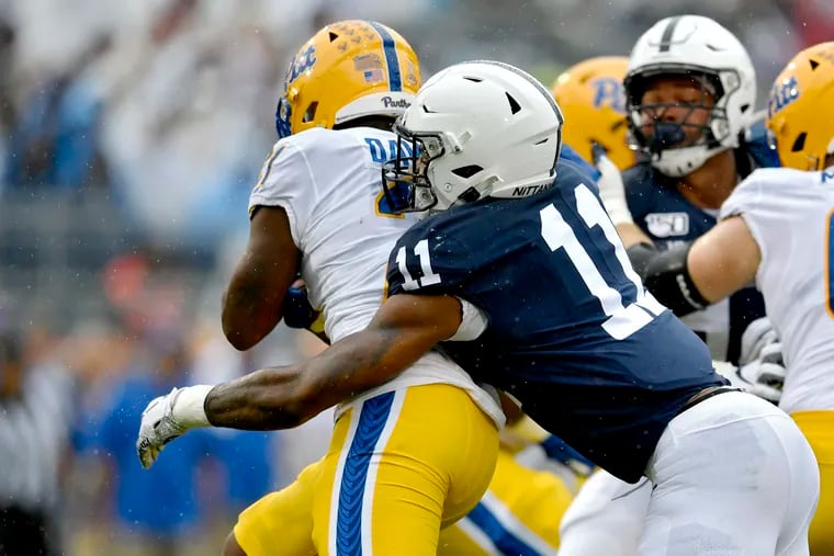 Penn State linebacker Micah Parsons tackles Pitt's Vincent Davis during the game on Saturday, Sept. 14, 2019. (Abby Drey/The Centre Daily Times/TNS)