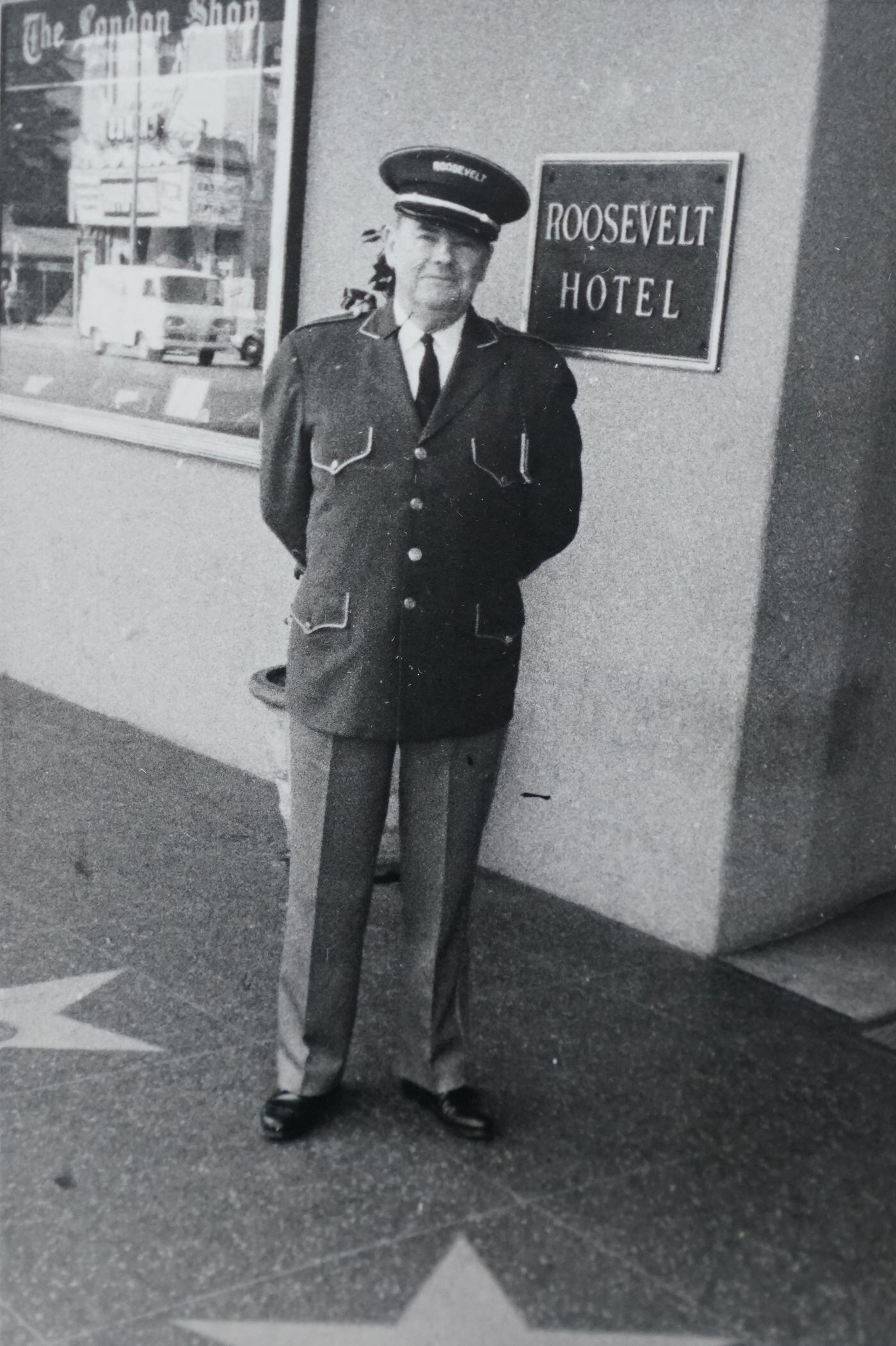 An older Richard Brian stands outside the Roosevelt Hotel in a picture taken not long before his retirement. The stars at his feet date the photo to between 1960, when the Hollywood Walk of Fame appeared, and 1969, when he retired.