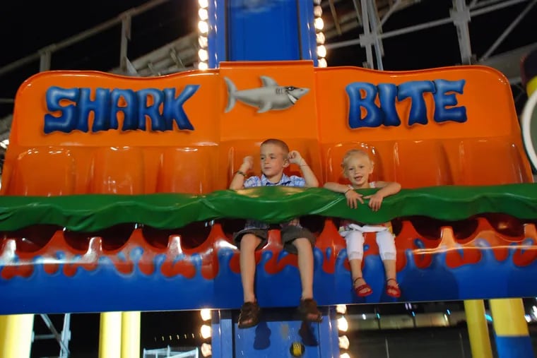 Ronan Nark and his sister, Remi Nark, on a ride along the Wildwood boardwalk in 2007.