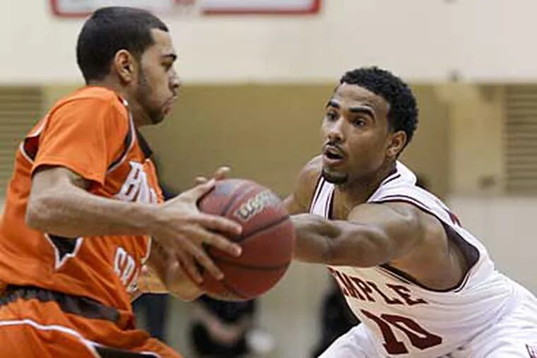 Temple's Luis Guzman (right) tries to steal the ball from Bowling Green's Jordan Crawford. (Yong Kim / Staff Photographer)