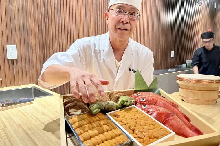 Chef Minoru Ogawa shows uni and fish to a customer at the omakase counter at Ogawa Sushi & Kappo, 310 Market St.