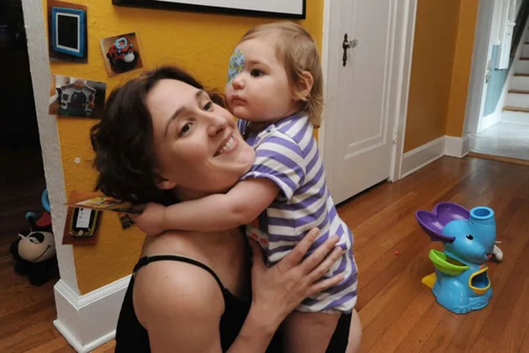 Meghan Wilson and daughter Vivian, 2, at their home in Scotch Plains, N.J. Wilson and her husband believe medical use of marijuana could help their daughter with a form of epilepsy. (APRIL SAUL / Staff Photographer)