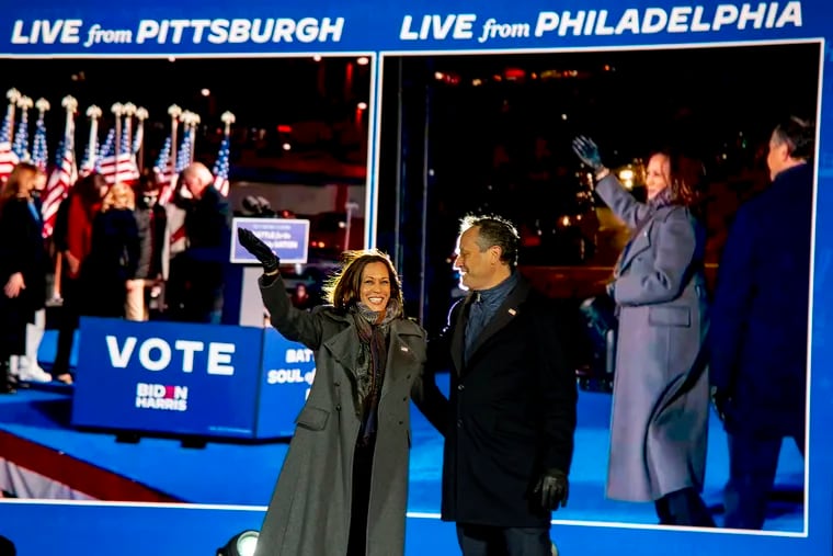 Democratic vice presidential candidate Kamala Harris and her husband Douglas Emhoff appear on stage and on a split TV screen with her running mate former Vice President Joe Biden and his wife Jill Biden on stage in Pittsburgh, at the end of two cross-state election eve drive-in rallies in Pittsburgh and outside Citizens Bank Park.